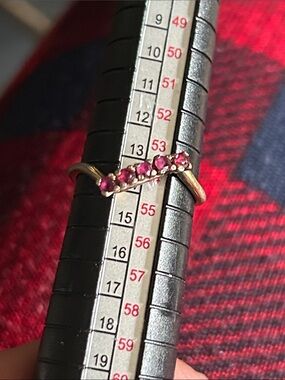 Vintage sterling silver dainty ring with five rubies.